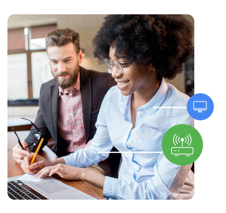 Colleagues use internet on laptop